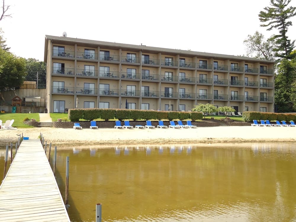 Beachfront Hotel featured exterior or lobby in Houghton Lake, MI — similar hotel