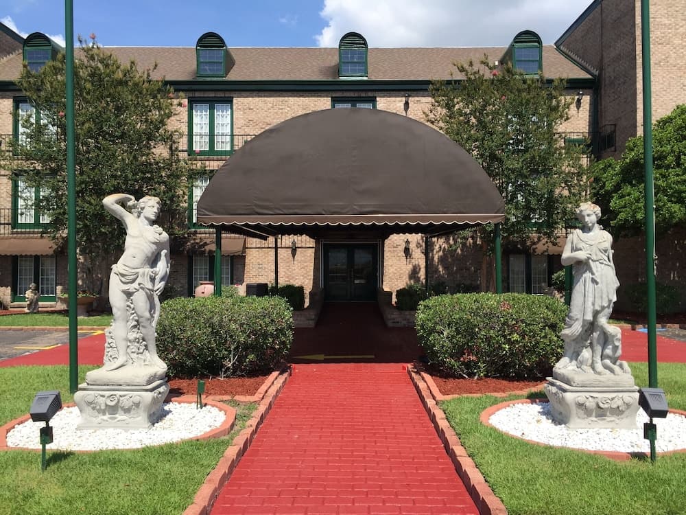 Royal Suites featured exterior or lobby in Baton Rouge, LA — similar hotel