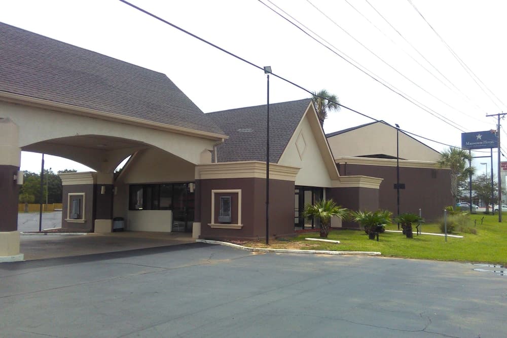 Regency inn and Suites featured exterior or lobby in Pensacola, FL — similar hotel
