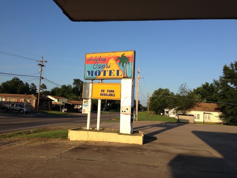 OYO Holiday Capri Motel & Rv Park featured exterior or lobby in Booneville, AR — similar hotel