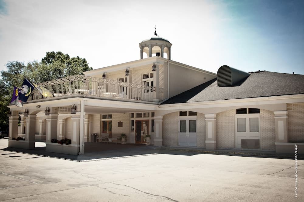 Carmel Inn & Suites featured exterior or lobby in Thibodaux, LA — similar hotel