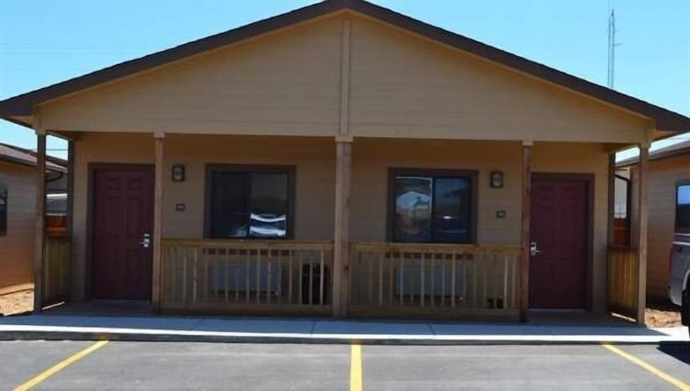 The Texas Lodge featured exterior or lobby in Gonzales, TX — similar hotel