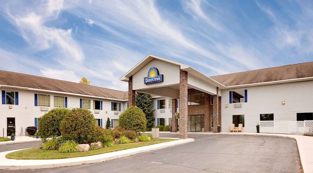 Days Inn by Wyndham Cadillac featured exterior or lobby in Cadillac, MI — similar hotel