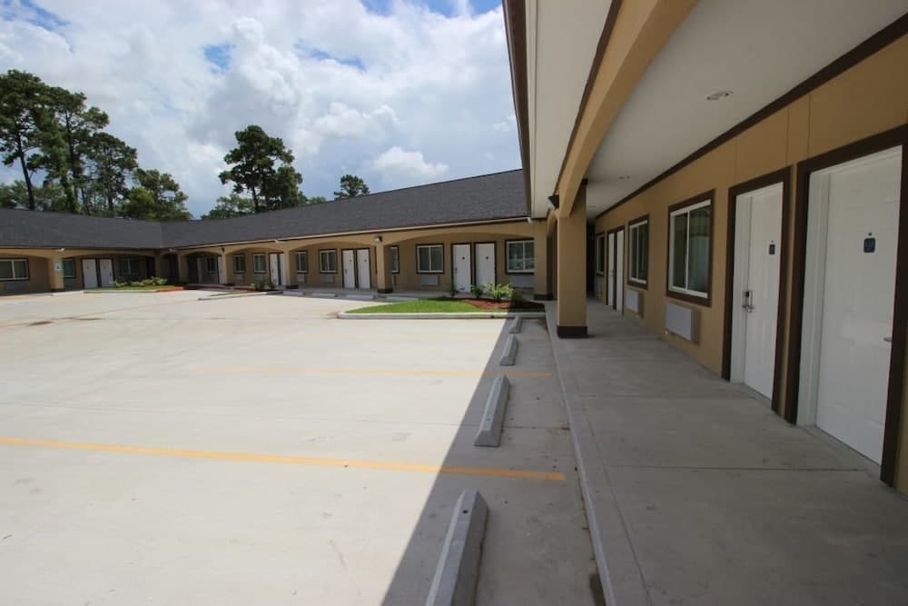 Scottish Inn & Suites featured exterior or lobby in Baytown, TX — similar hotel