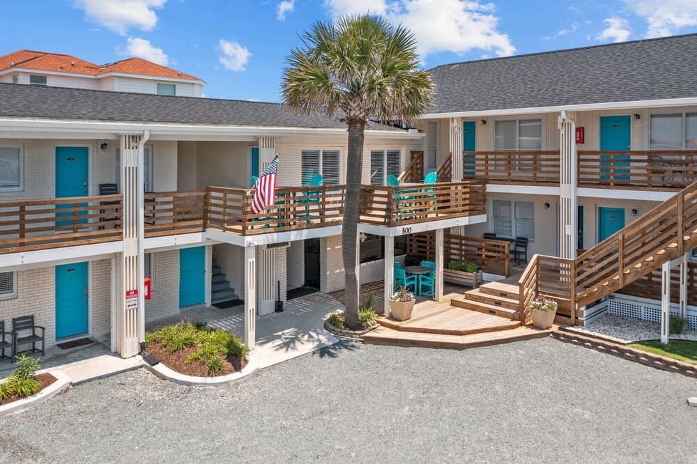 The Beach House Motel & Suites featured exterior or lobby in Oak Island, NC — similar hotel