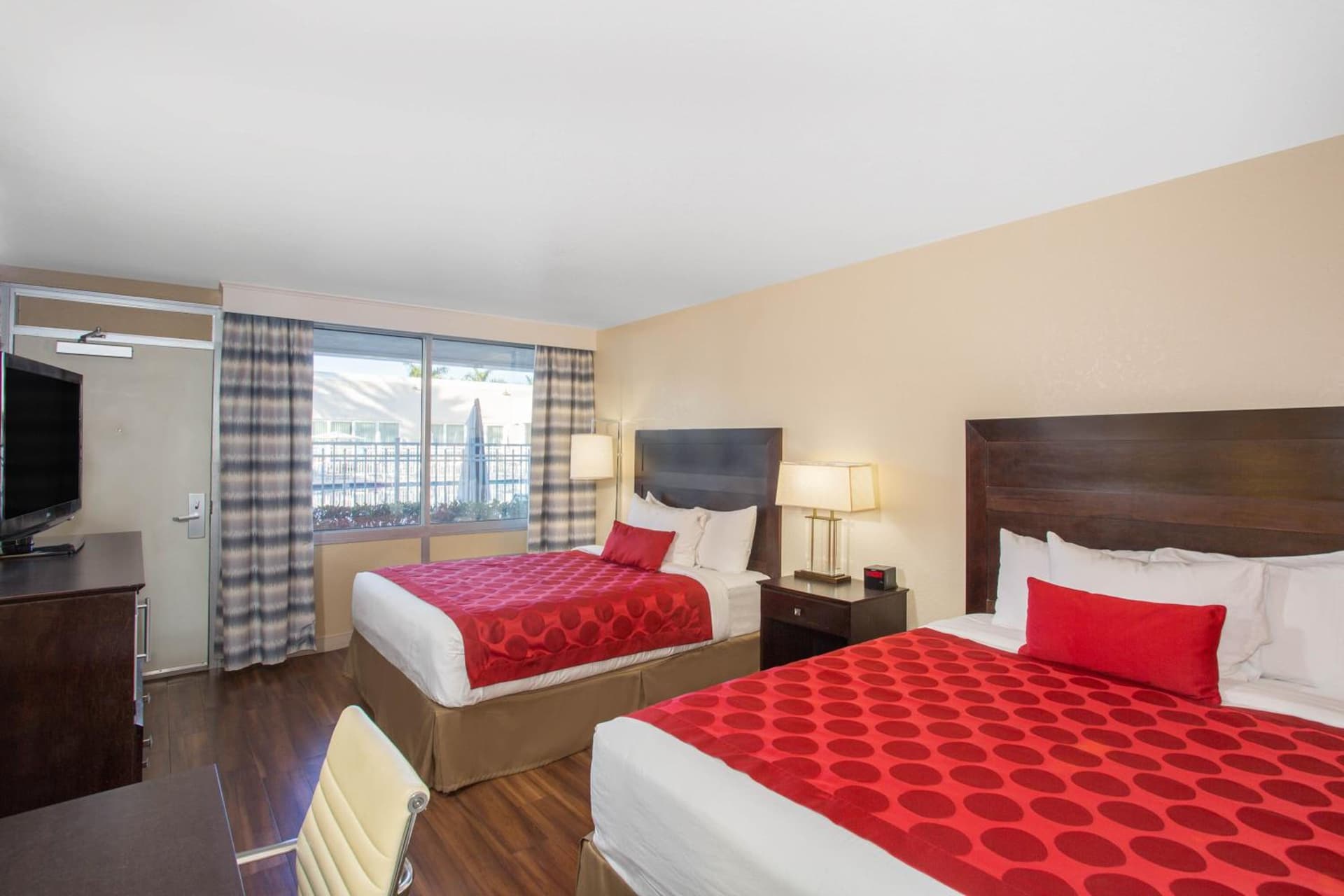 Queen Room with Two Queen Beds and Courtyard Vew - Non-Smoking at Ramada by Wyndham Venice Hotel Venezia in Venice, FL