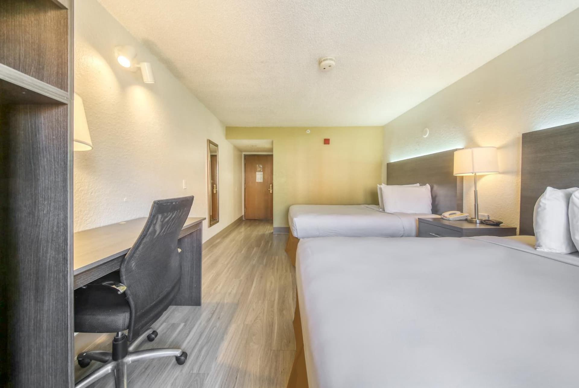 Queen Room with Two Queen Beds - Disability Access with Roll-In Shower at Baymont by Wyndham Orlando-International Dr-Universal Blvd in Orlando, FL