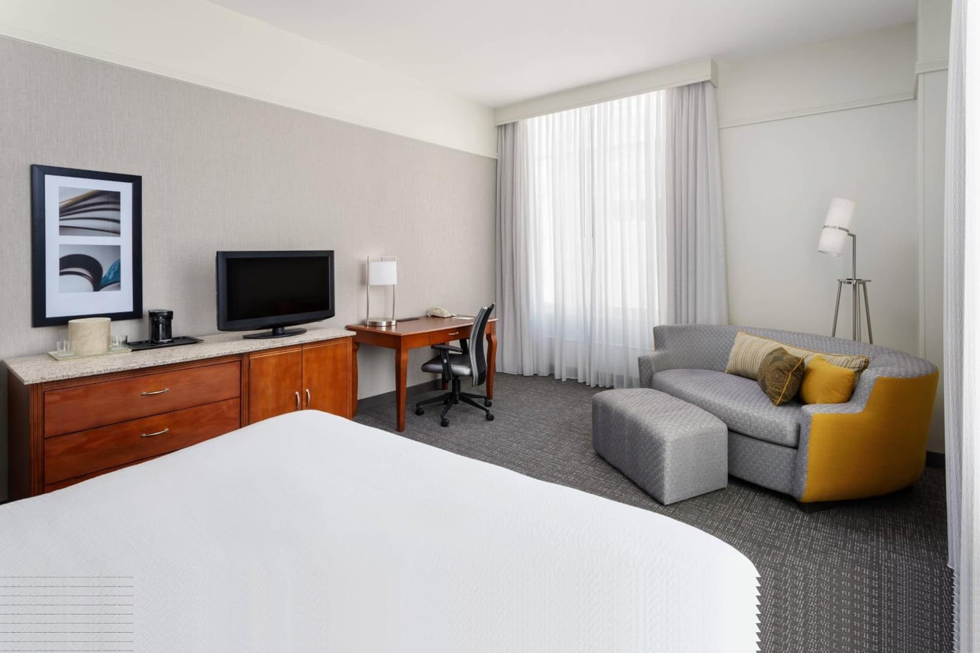 Larger Guest room, 1 King, Corner room at Courtyard Houston Downtown Convention Center in Houston, TX