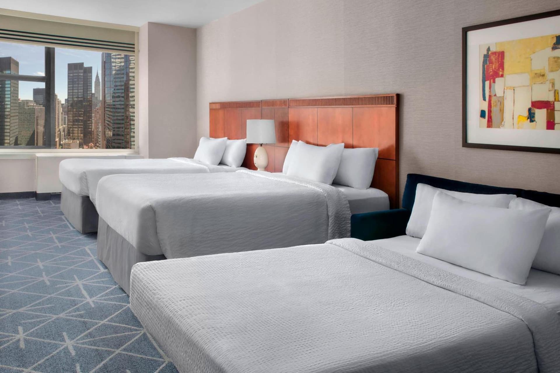 Queen Room with Two Queen Beds and Sofa Bed at Courtyard New York Manhattan/Midtown East in New York, NY