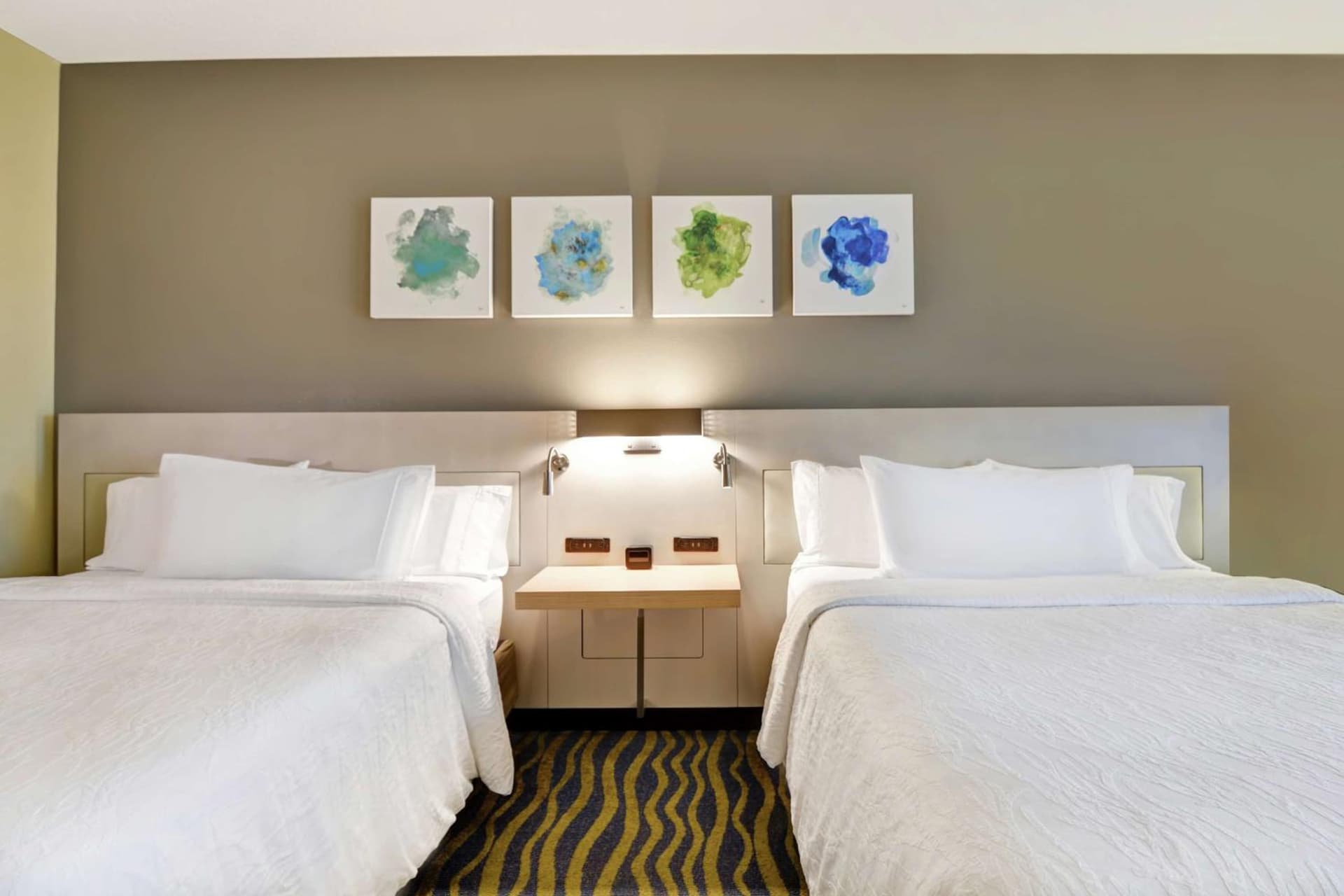 Queen Room with Two Queen Beds at Hilton Garden Inn Orlando Lake Buena Vista in Orlando, FL