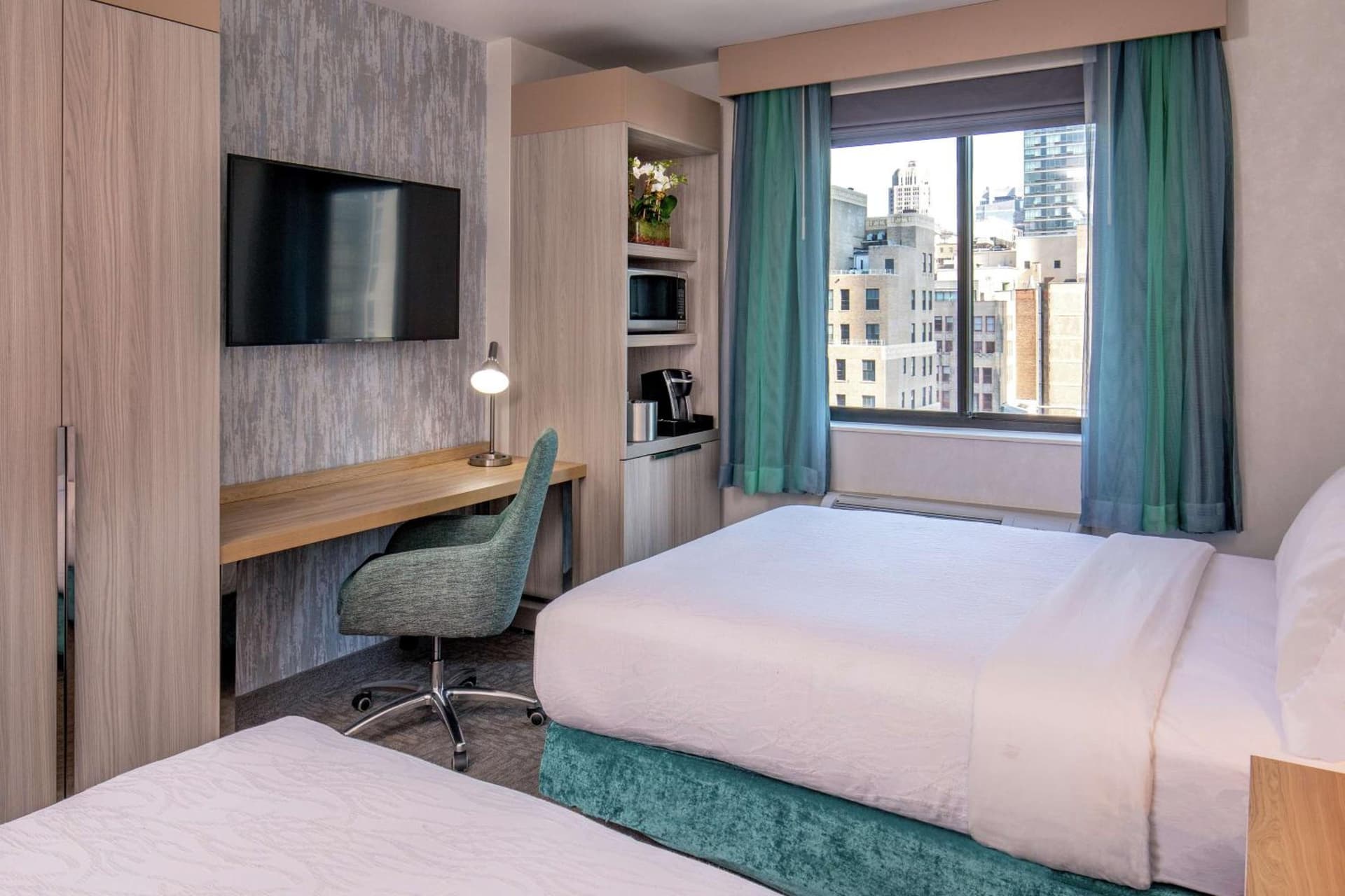 Queen Room with Two Queen Beds with City View  at Hilton Garden Inn New York/Manhattan-Chelsea in New York, NY