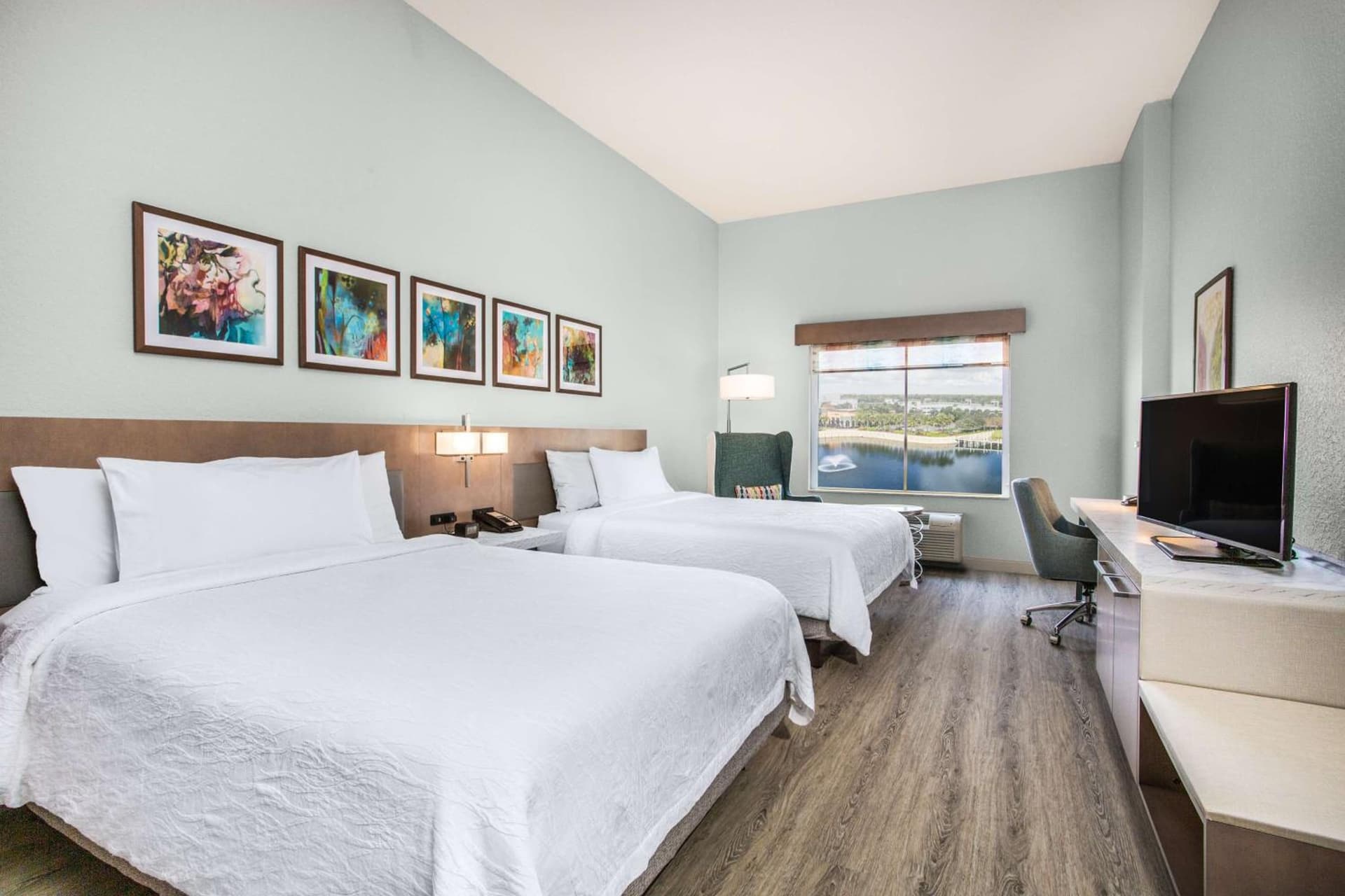 Queen Room with Two Queen Beds and Lake View at Hilton Garden Inn Palm Beach Gardens in Palm Beach Gardens, FL