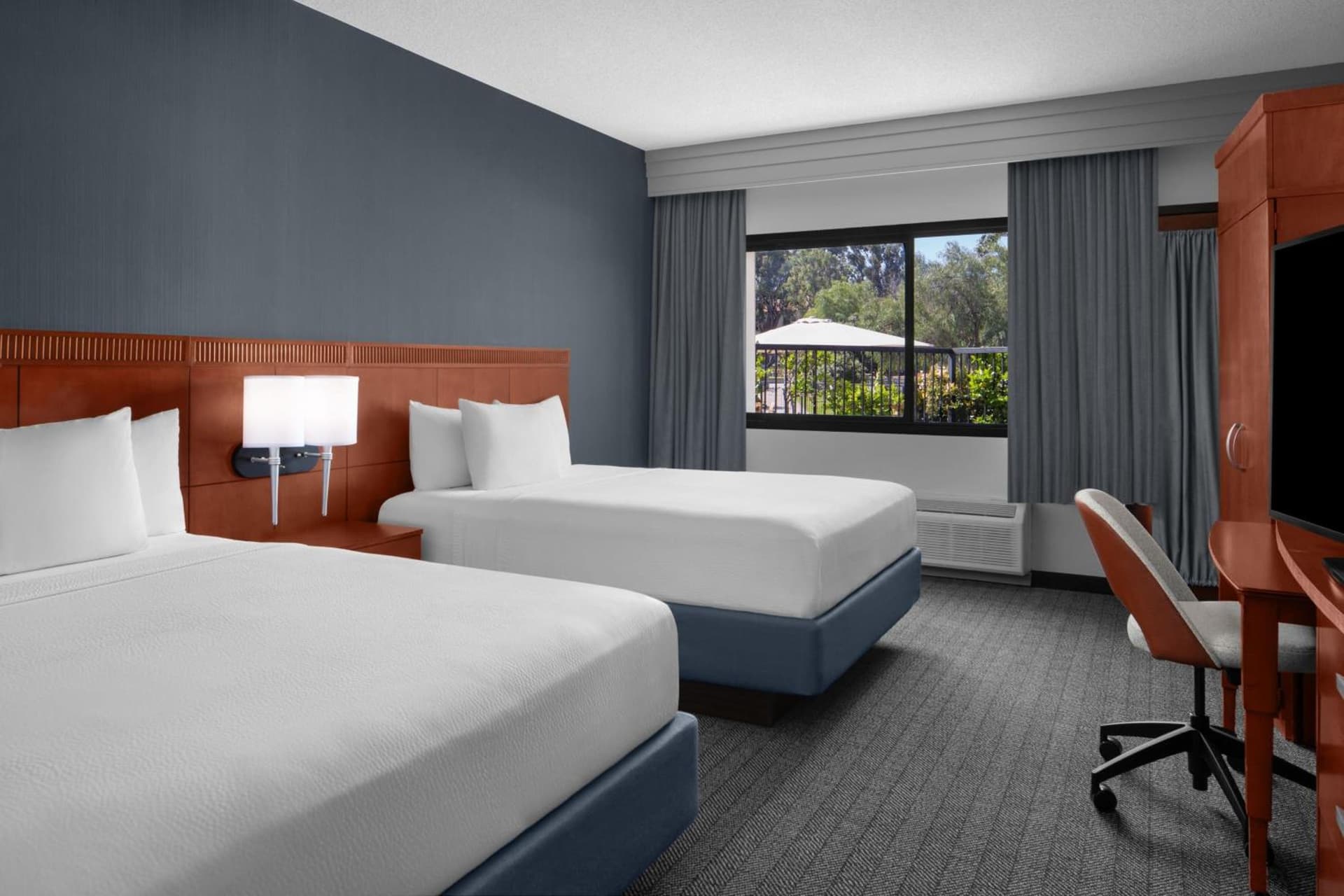 Queen Room with Two Queen Beds and Private Patio at Courtyard by Marriott San Diego Rancho Bernardo in Rancho Bernardo, CA