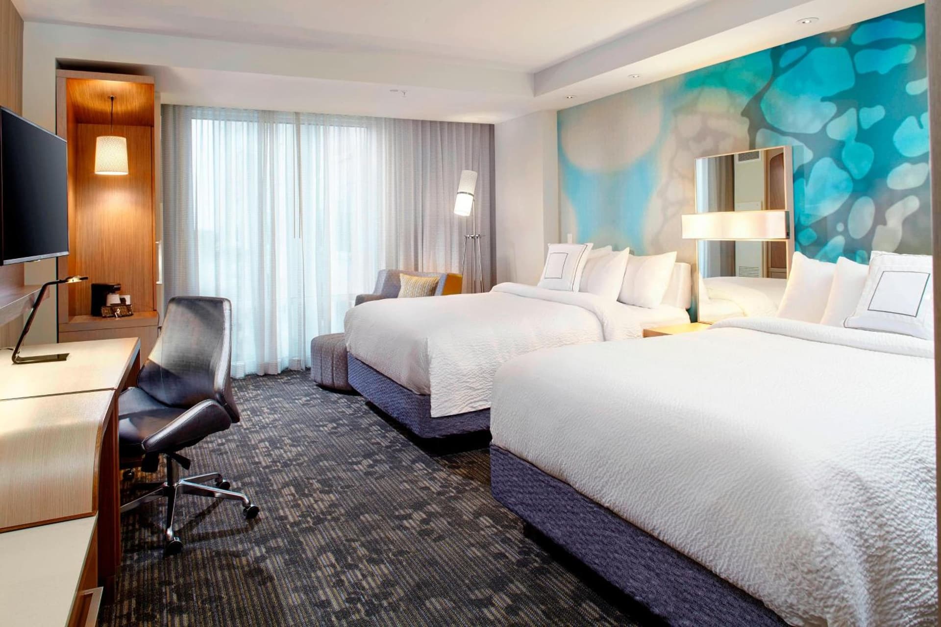 Queen Room with Two Queen Beds at Courtyard by Marriott Orlando Lake Nona in Orlando, FL