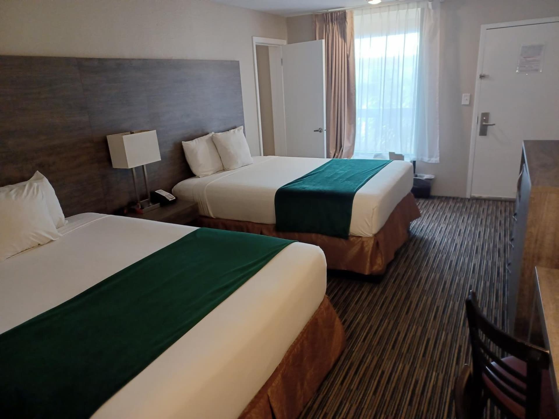 Queen Room with Two Queen Beds with Pool View at Grand Hotel Orlando at Universal Blvd - Shuttle to Theme Parks in Orlando, FL
