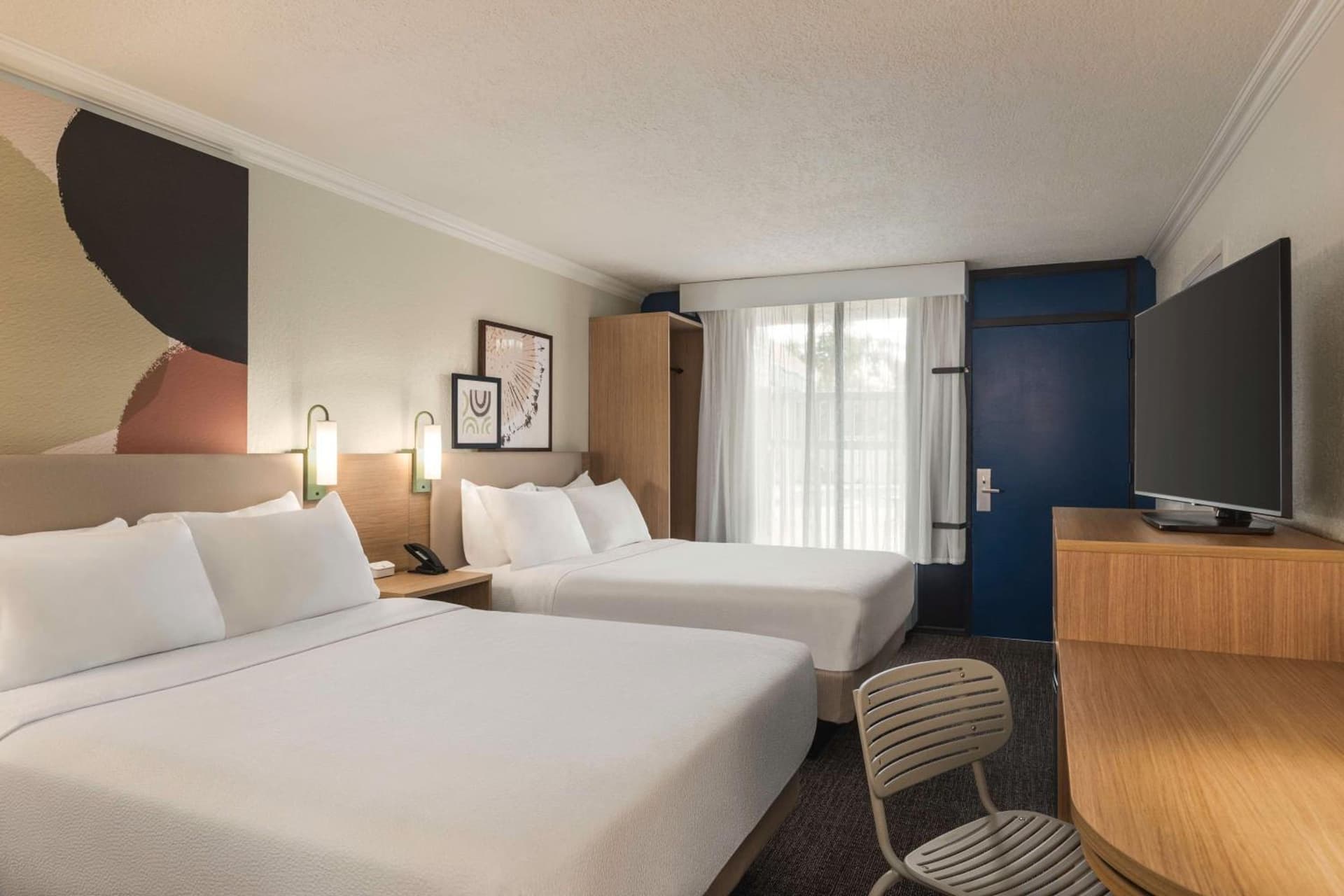 Queen Room with Two Queen Beds at Spark by Hilton Sarasota Siesta Key Gateway in Sarasota, FL
