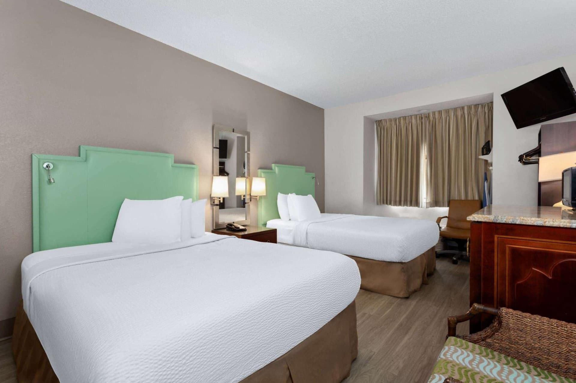 Queen Room with Two Queen Beds - Non-Smoking at Baymont by Wyndham Orlando-International Dr-Universal Blvd in Orlando, FL
