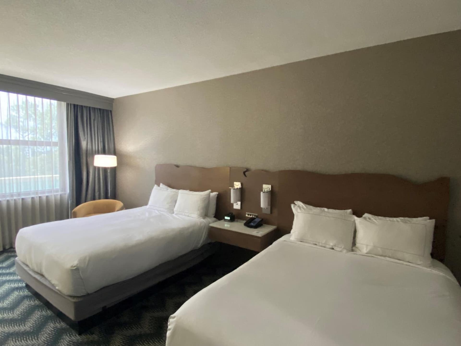 Queen Room with Two Queen Beds and Bath Tub - Mobility Accessible at Hilton Houston North in Houston, TX