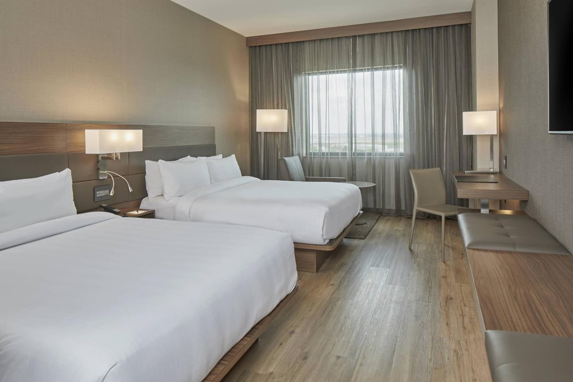 Queen Room with Two Queen Beds and Roll-in Shower - Mobility Accessible at AC Hotel by Marriott Atlanta Airport Gateway in Atlanta, GA