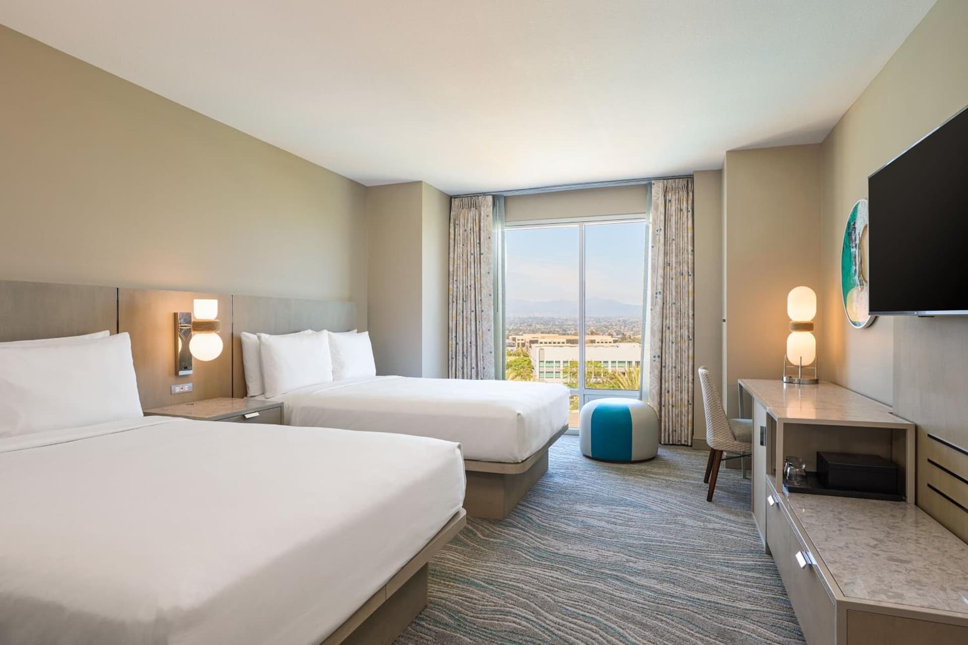 Queen Room with Two Queen Beds and Pool View at Renaissance ClubSport Aliso Viejo Laguna Beach Hotel in Aliso Viejo, CA
