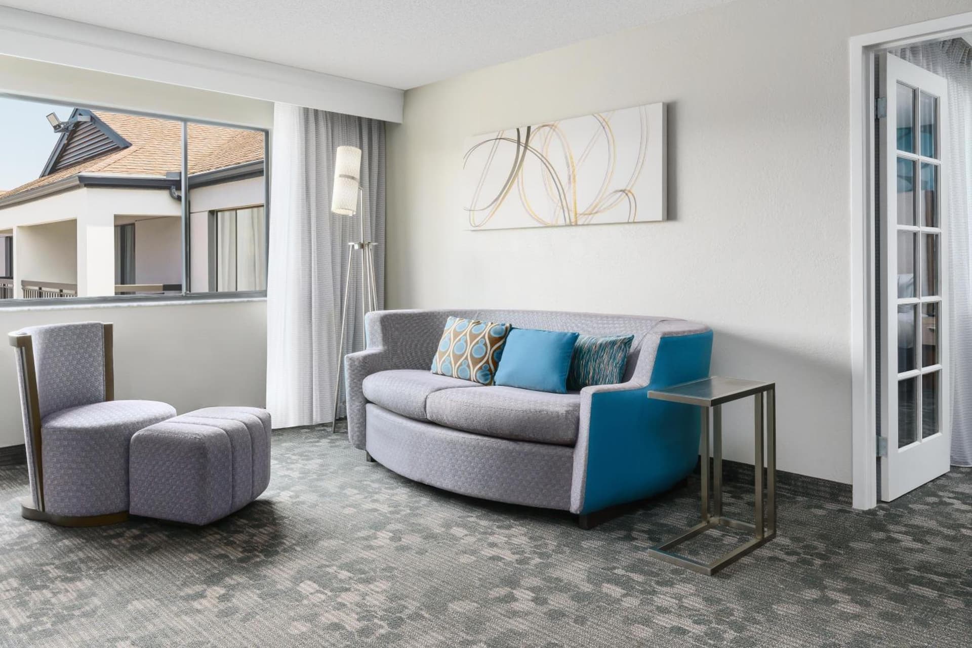 King Suite with Sofa Bed and Roll-in Shower - Mobility and Hearing Accessible at Courtyard by Marriott Orlando Lake Buena Vista at Vista Centre in Orlando, FL