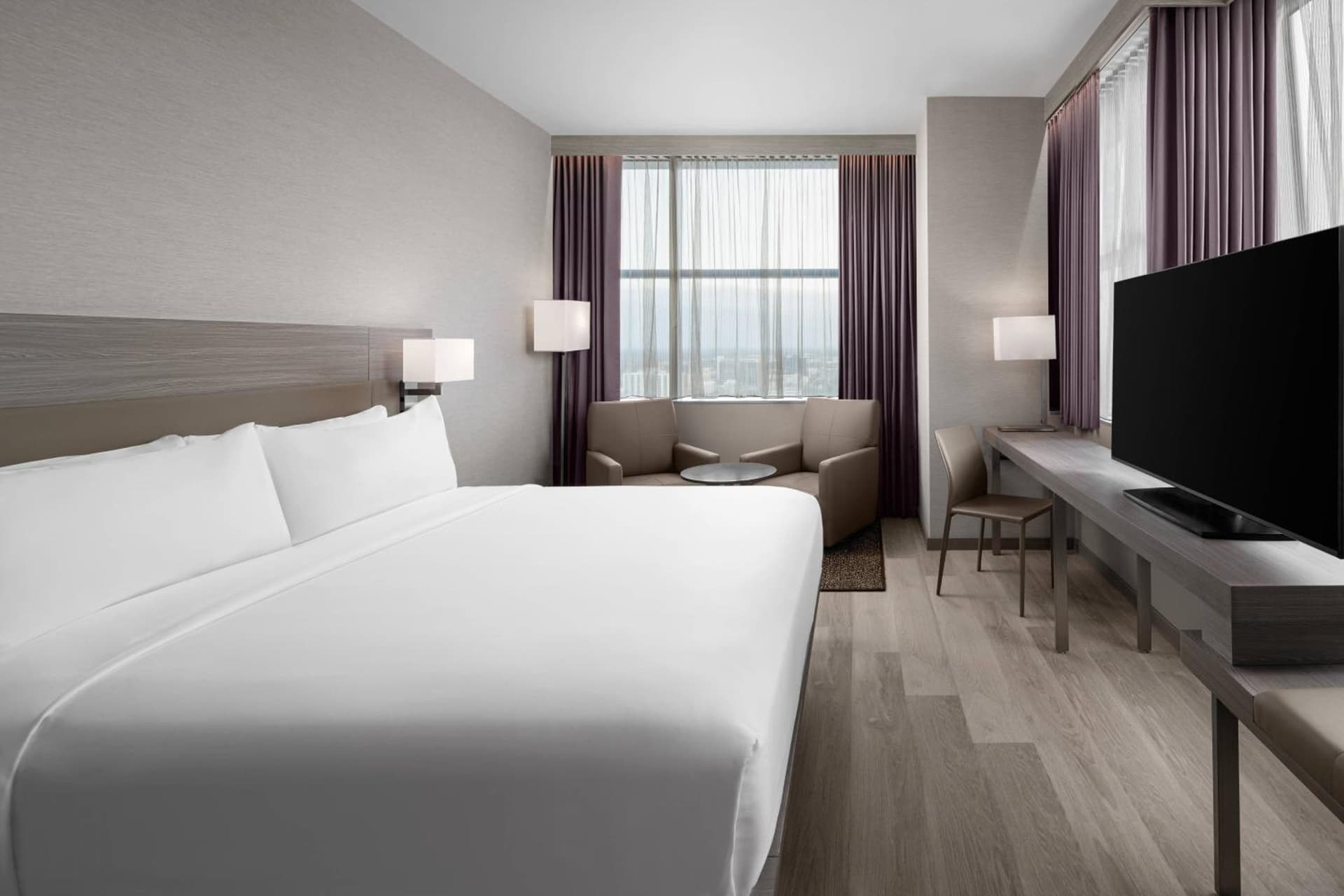 Larger Corner Guest room with 1 King at AC Hotel by Marriott Orlando Downtown in Orlando, FL