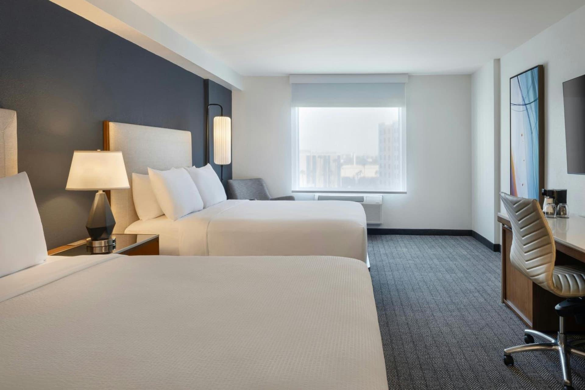 Queen Room with Two Queen Beds and City View at Courtyard by Marriott across Universal Orlando in Orlando, FL