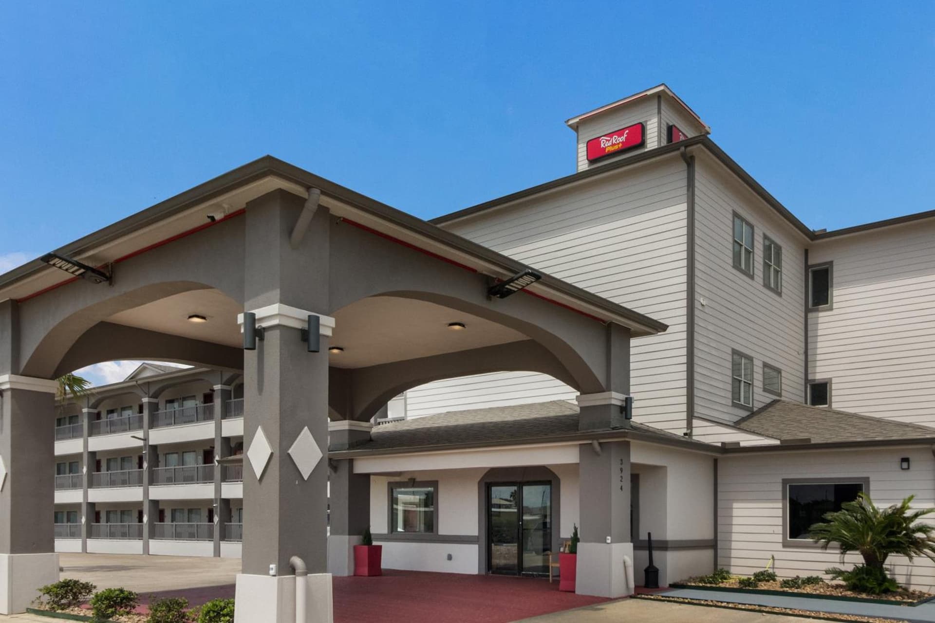 Red Roof Inn PLUS + Galveston - Beachfront exterior or lobby in Galveston, TX — main listing photo