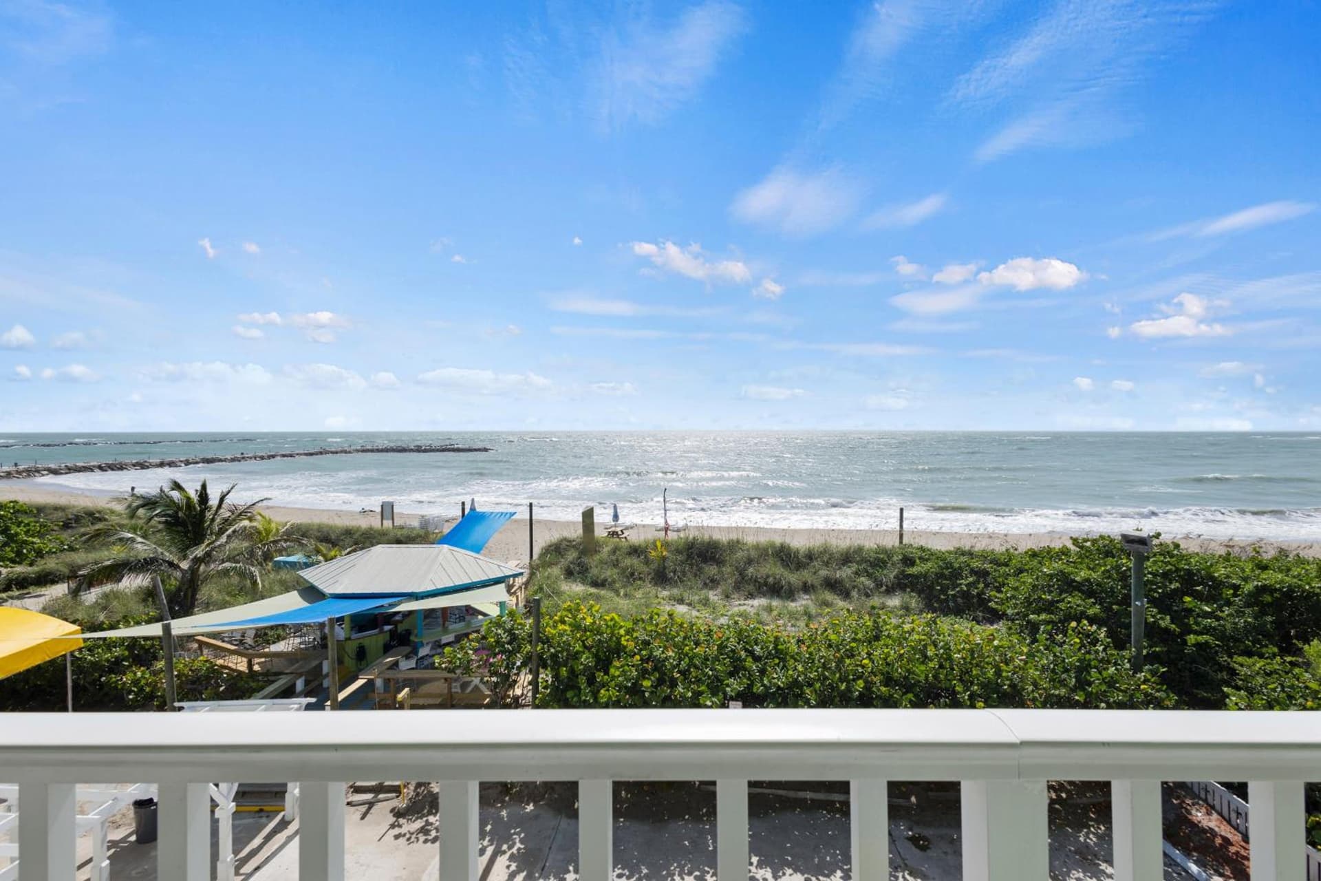 Ocean View Hotel Room with Balcony- King Bed #23 interior in Fort Pierce, FL — gallery photo 2