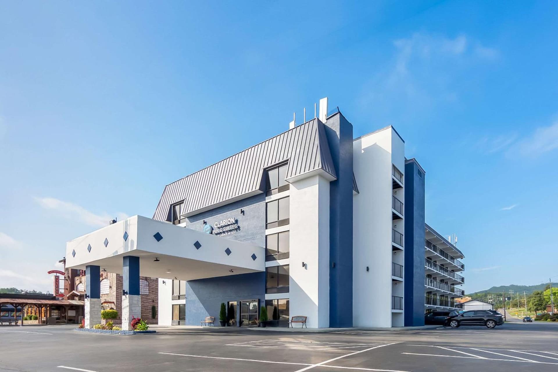 Clarion Inn & Suites near the Leconte Center Pigeon Forge featured exterior or lobby in Pigeon Forge, TN — similar hotel